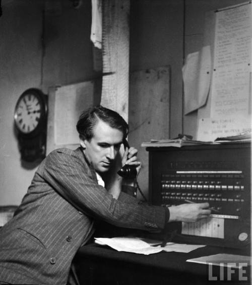 Photographerdesigner Cecil Beaton at the switchboard doing his duty as an Air Raid Precautions operator on the estate of Lord and Lady Pembroke-- circa 1940